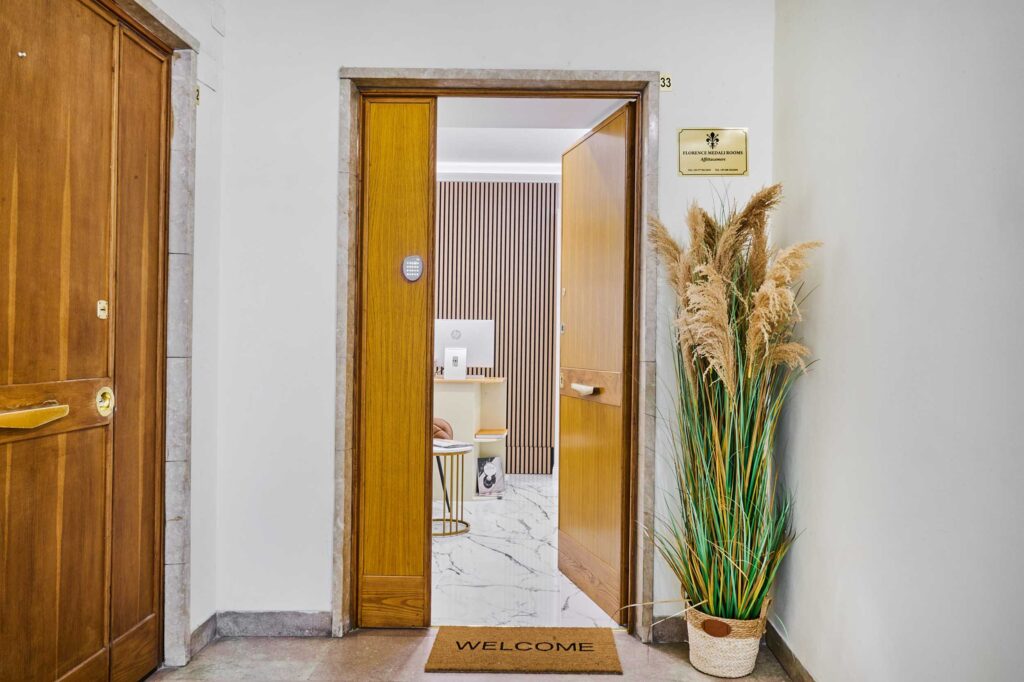 Ingresso accogliente di Florence Comfort Rooms con tappeto welcome
